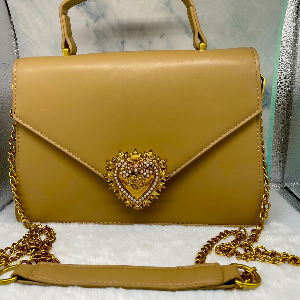 A practically brand new Dolce and Gabana purse. Smooth calfskin devotion bag.